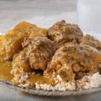 Curried Chicken Bone-In Plate · Marinated chicken slow cooked in a seasoned curry sauce.
