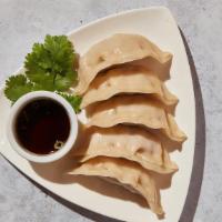 Steamed Dumplings · Steamed pork and veggie dumplings served with dumpling sauce. Contains gluten. We cannot mak...
