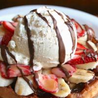 Rogier Waffle · Bananas, strawberries, Nutella, caramel, and whipped cream.