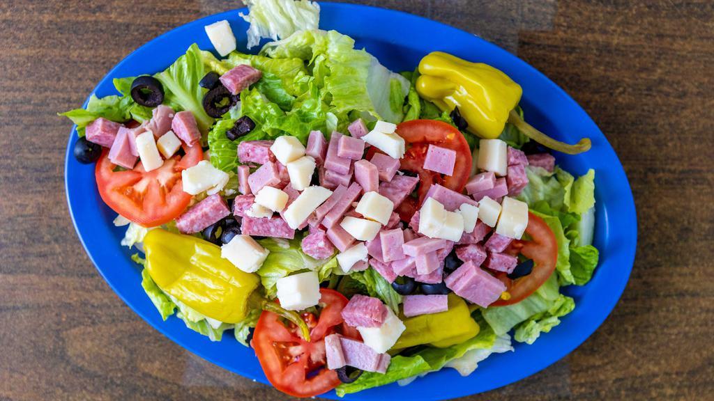 Trio'S Salad · Lettuce, tomato, black olives, diced ham, salami, provolone cheese & pepperoncini.