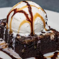 Decadent Chocolate Brownie · Iced chocolate brownie. Served with chocolate and caramel sauce. *Brownie does contain nuts!*