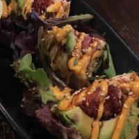 Dragon Ball · Deep-fried stuffed avocado, crabmeat, and spicy tuna topped with chef's sauce.