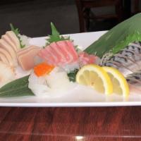 Sashimi Platter · Two pieces of tuna, salmon, and yellowtail sashimi.