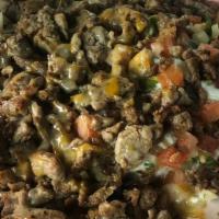 Carne Asada Fries · beans, chesse, guacamole, sour cream, pico de gallo, anny meat.