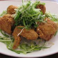 Padak · Fried chicken  (drum, stick, thigh, wing, a breast) with raw green onions.
Drumstick, thigh,...