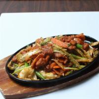 Spicy Stir Fry Pork · Savory slightly spicy port belly with veggies.
Served with steamed rice.