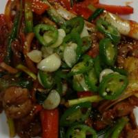 Spicy Stir Fry Chicken Feet · Stir fried chicken feet with onions, carrot and green onion.