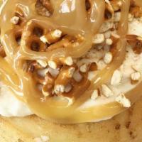Salted Caramel Cheesecake Roll* · To make our Salted Caramel Cheesecake Roll we top cream cheese frosting with salted pretzel ...