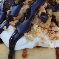 Cookie Dough Cheesecake Roll* · cheesecake frosting topped with homemade chocolate chip cookie dough, graham cookies and cho...