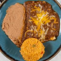 Taco Beef Enchiladas · Select a sauce: chili con queso adobado or chili con carne.