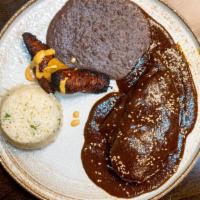 Mole House Specialty · Roasted chicken breast on a bed of our house mole sauce, served with arroz blanco, plantains...