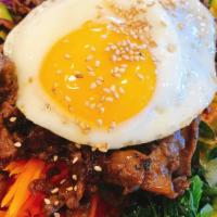 Beef Bulgogi Bibimbap · Korean bulgogi sauce marinated rib eye beef with steamed rice and all kinds of veggies with ...