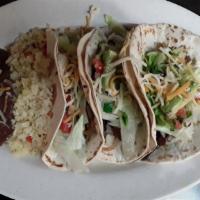 Beef Fajitas Tacos (3) · Beef fajitas served with beans, rice and salad.
