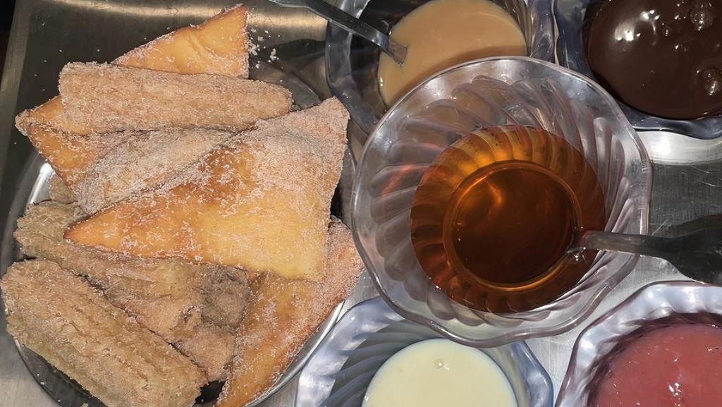 Sopapilla Cart · Sopapillas served with assorted dipping sauces.