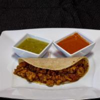 Chicharron Prensado En Salsa Verde (Pork Skin In Tomatillo Sauce) · **All tacos have refried beans