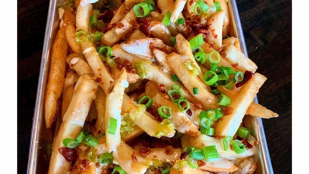 *Loaded Fries · Thick cut fresh fries topped w/ house-made Ranch queso, chopped bacon, scallions & diced house-made pickled jalapeno,