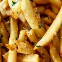 *Truffle Fries · Thick cut french fries tossed in truffle oil, kosher salt & topped with parsley and grated R...