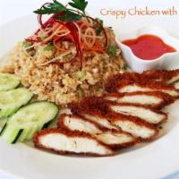 Crispy Chicken With Garlic Rice · Crispy chicken served with fried rice with eggs, garlic, butter, cucumbers and sweet chili s...