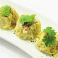 Shumai Pot Sticker (5) · Open dumplings stuffed with ground shrimp, pork and vegetables, topped with fried garlic ser...