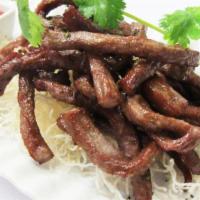 Thai Beef Jerky (8 Oz) · Fried marinated beef strips served with spicy sriracha sauce