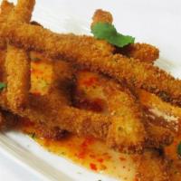 Fried Calamari · Crispy fried calamari steak strips served with sweet chili sauce.