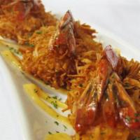 Coconut Shrimp (4) · Crispy fried butterfly shrimp tossed in organic coconut flakes & served with spicy mayo.