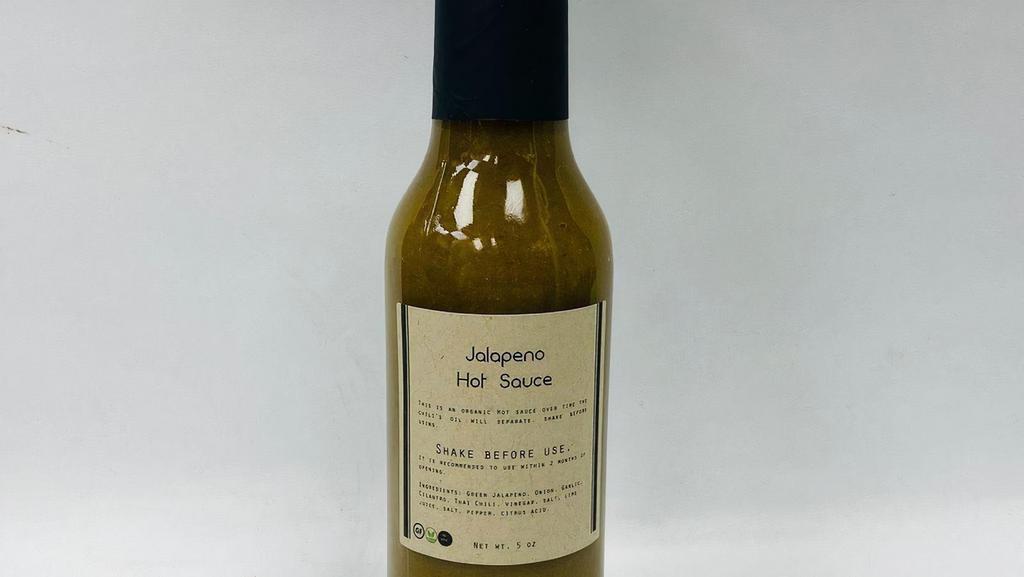 Bottled Jalapeno Hot Sauce · This hot sauce uses our organic grown jalapenos. This sauce is blend with herbs and spices that provide a tangy spicy flavor, not to spicy but just right.