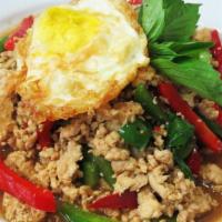 Thai Style Chicken Basil · Minced chicken with bell peppers, onions and basil leaves in garlic basil sauce topped with ...