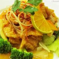 Orange Chicken · Crispy chicken, flavored with orange served a top steamed vegetables. Served with white rice.