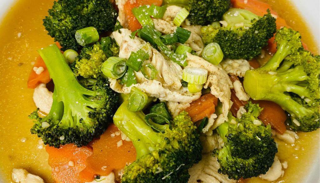 Chicken & Broccoli · Stir-fry chicken, broccoli and carrots in a light brown sauce. Served with white rice.