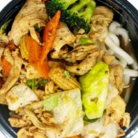 Pepper Garlic Stir-Fry Noodle Bowl · Stir fry noodles topped with broccoli, cabbage, carrot, and baby corn in a pepper garlic sauce