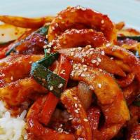 Spicy Stir Fried Squid · Chopped squid stir fried in a spicy sauce with glass noodles. Served with rice.