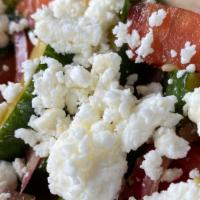 Cucumber Tomato Salad  · Cucumber tomato salad in our house soy basil vinaigrette. topped with feta cheese (served on...