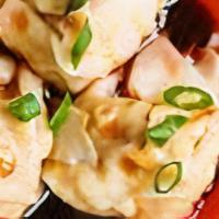 Spicy Chili Wontons (6) (* S) 红油抄手 · Pork and Shrimp wontons in Sichuan chili oil with peanut and Cilantro.