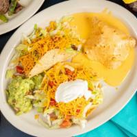 Summer Plate · One taco, one chalupa, guacamole and chili con queso puff (no rice or beans).
