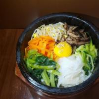 Hot Stone Mixed Rice & Vegetable Bowl (Dolsot Bibimbap) · Dolsot bibimbap - a bowl of rice, vegetables, egg yolk, and your choice of either assorted s...
