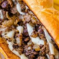 Philly Cheesesteak Sandwich · Seasoned thin sliced ribeye steak with Pepper Jack cheese, grilled onions, grilled peppers, ...