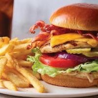 Chicken Sandwich With Bacon · Fire grilled seasoned chicken breast topped with hickory smoked bacon, Pepper, Jack cheese o...