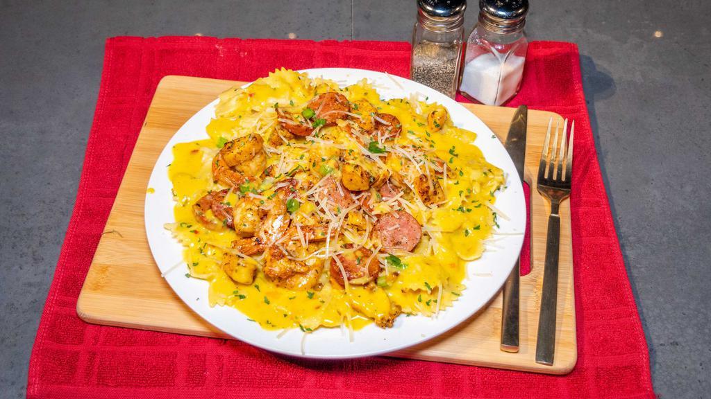 Plush Signature Pasta · Farfalle pasta - seasoned fire grilled sliced chicken breast - jumbo seasoned shrimp - sliced beef sausages - sauteed onions, peppers drizzled with plush signature Alfredo sauces.
