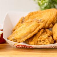 Traditional Wings (10 Pieces) · Our wings are always fried to perfection, come tossed in your choice of Krispy, traditional ...