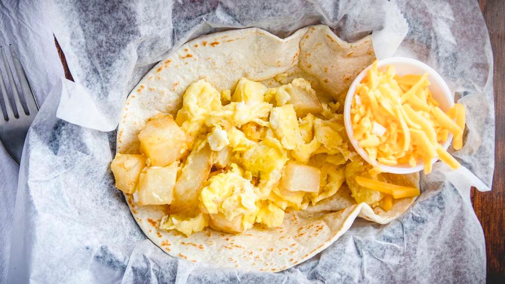 #101. Egg And Potatoes Breakfast Taco · Add cheese for an additional charge.