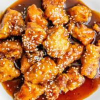 Sesame Chicken · Chunks of boneless chicken, breaded sauted with tangy and sweet brown sauce topped with sesa...