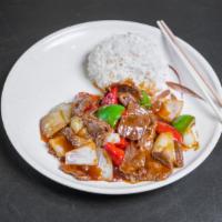 Pepper Steak · Sliced beef cooked with green bell pepper, onion and carrots in tasty brown sauce.