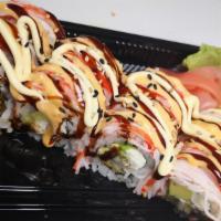 Flaming Roll · Shrimp tempura avocado cream cheese inside with imitation crab on top, drizzled with eel sau...