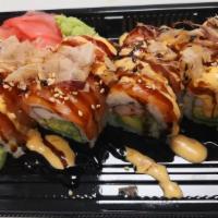 Yammy Yammy Roll · Imitation crab, avocado, cucumber, cream cheese wrapped with salmon on top, drizzled with ee...