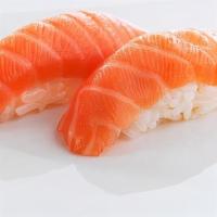 Scottish Salmon (2 Pieces) · Scottish, sushi rice topped with slices of raw fish.