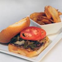 Southwestern Burger · Pepper jack cheese, caramelized onions, roasted poblano peppers, tomato, and chipotle aioli.