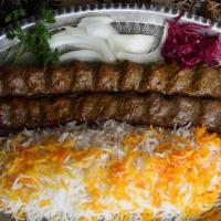 Kabob Koobideh & Rice · Gluten free. 2 skewers of juicy ground beef kabobs served over fluffy saffron rice, with sid...