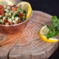 Persian Salad (Salad Shirazi) · Gluten free. Chopped tomatoes, red onion, cucumbers, mixed with mint, olive oil, lemon juice...