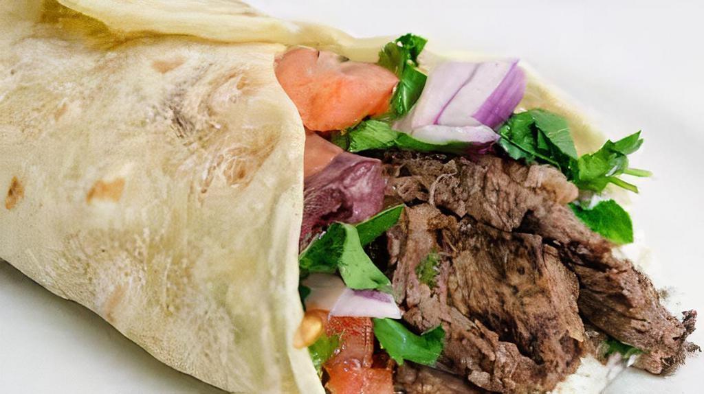 Gyro Wrap · Lettuce, onions, tomatoes, cucumbers, tzatziki and feta cheese, wrapped with pita bread.